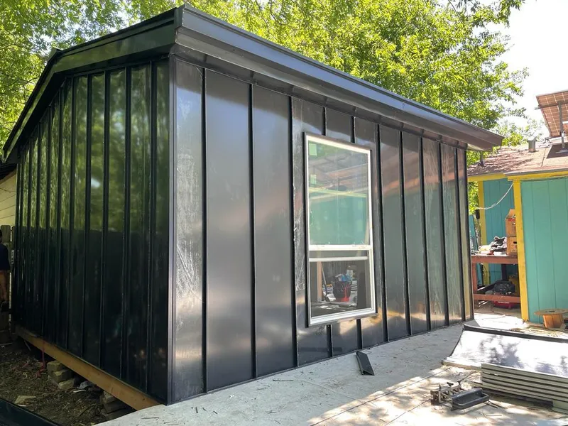 Black standing seam metal wall panels for Metal Roof Installation in Hillside